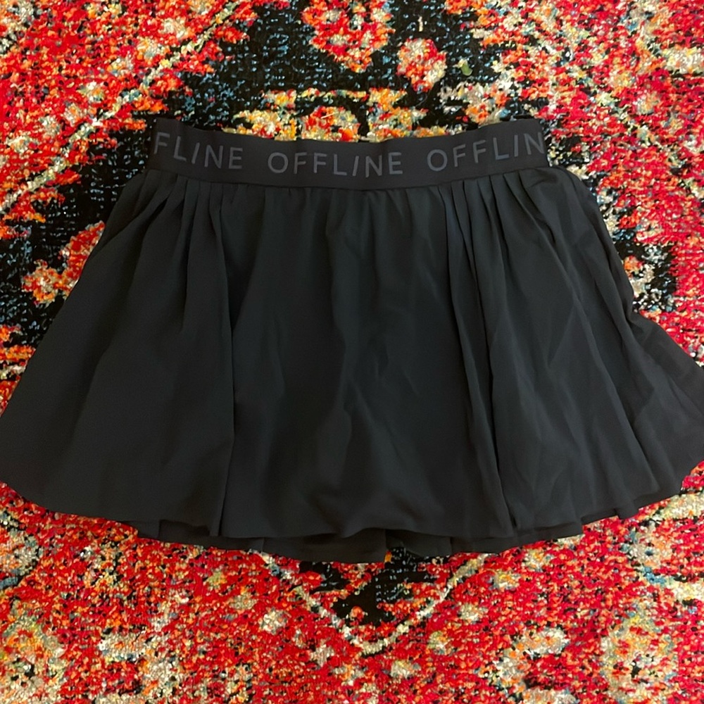Pleaded off-line black tennis skirt
